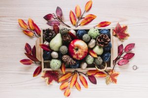 autumn-elements-and-fruits-in-wooden-box_23-2147881166